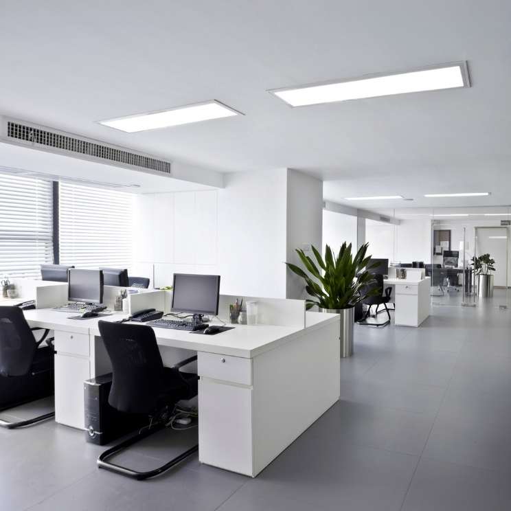 Corporate office with computers and LED lighting.