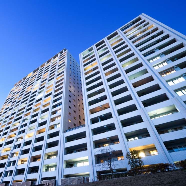 Apartment building with lights on at night.